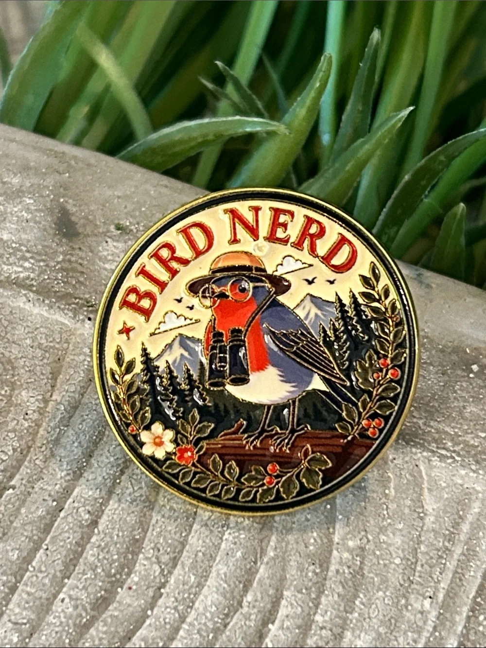 Bird Nerd Enamel Pin - Robin wearing binoculars in a garden forest scene